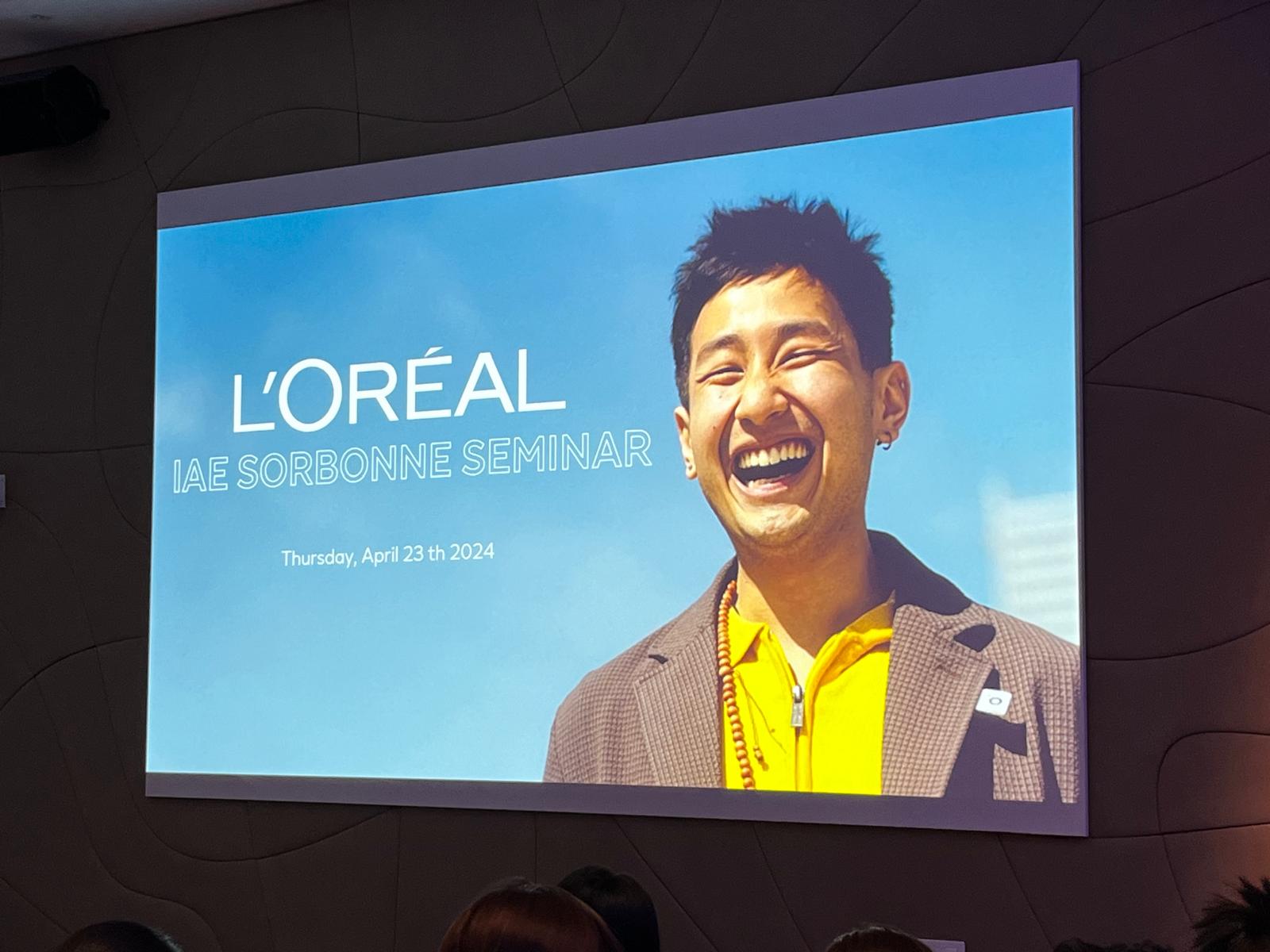 Vietnamese at L'Oréal headquarters with a slide